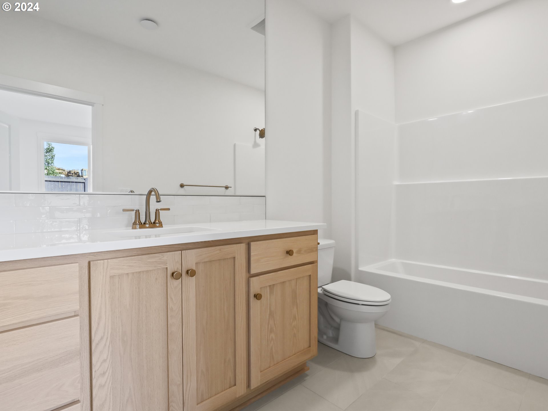 4400 North 12th Way Ridgefield, WA 98642 - Photo 24 of 31 a bathroom with a sink a toilet and shower