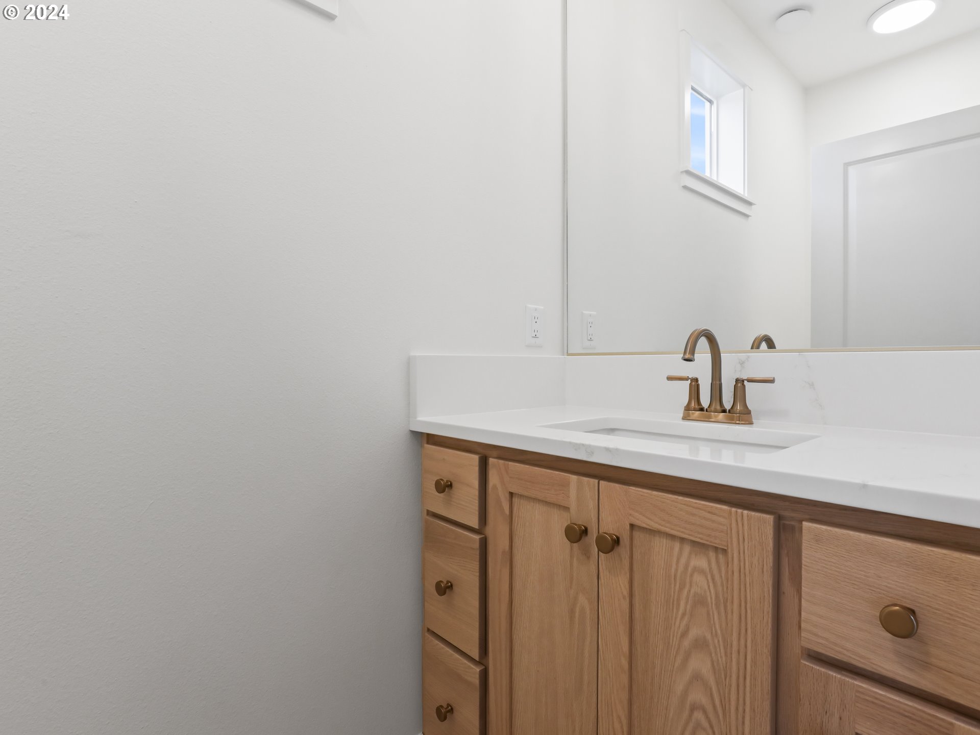 4400 North 12th Way Ridgefield, WA 98642 - Photo 3 of 31 a bathroom with a sink and a mirror