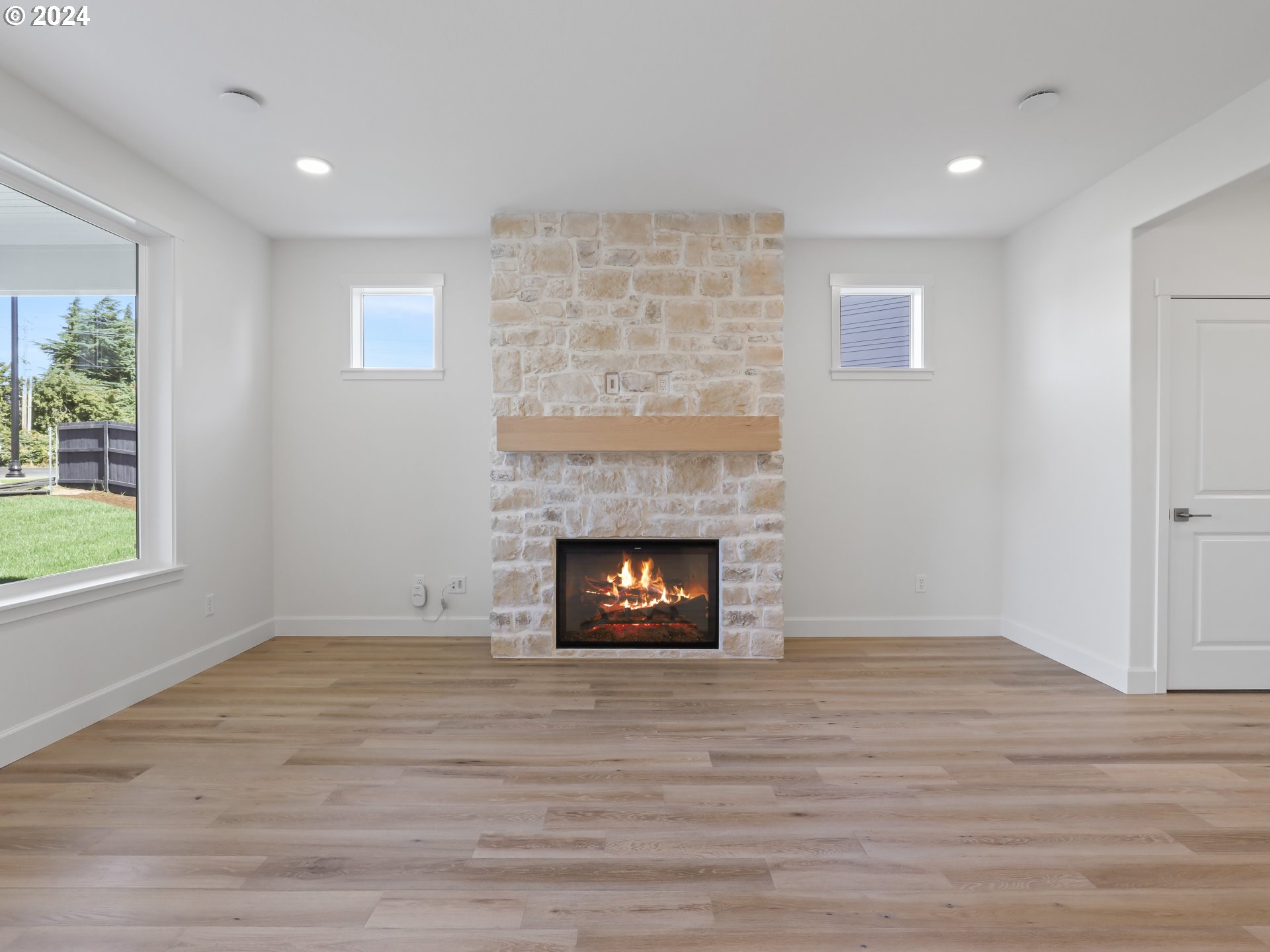 4400 North 12th Way Ridgefield, WA 98642 - Photo 6 of 31 a living room with a fireplace and a window