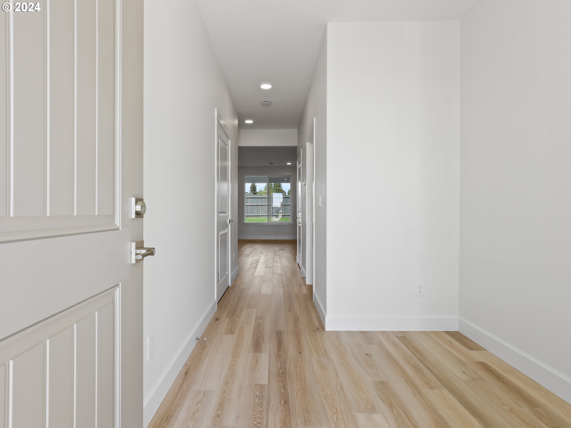 4400 North 12th Way Ridgefield, WA 98642 - Photo 8 of 31 a view of a hallway with wooden floor