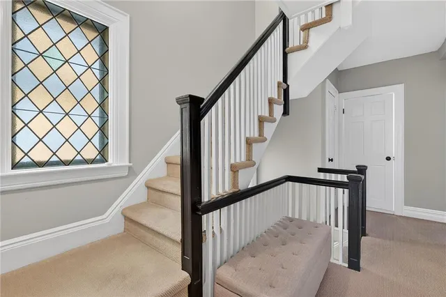 a bedroom with two beds and a window