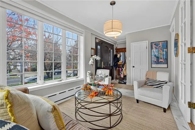a living room with furniture fireplace and a flat screen tv