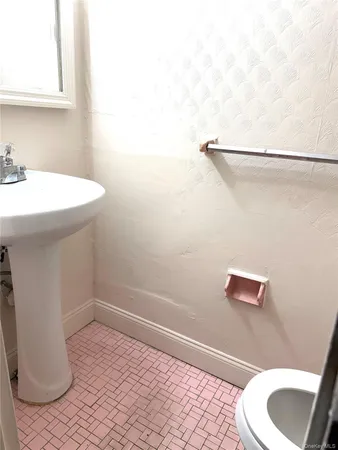 a bathroom with a sink and a toilet