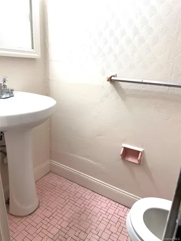 a bathroom with a sink and a toilet