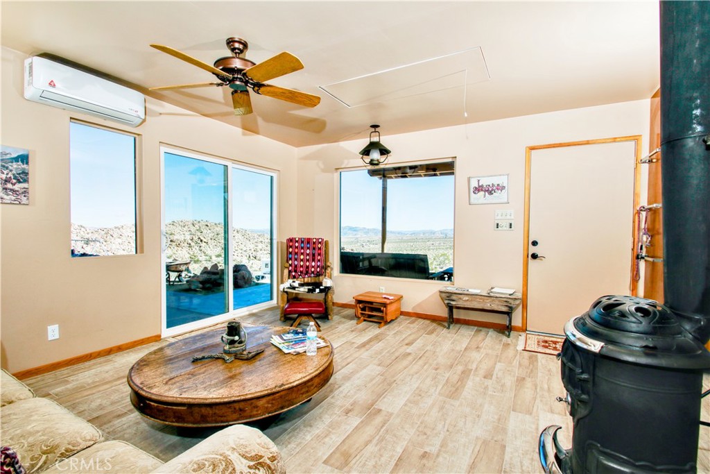 4650 Sizer Canyon Road Johnson Valley, CA 92285 - Photo 13 of 36 a living room with furniture and a wooden floor