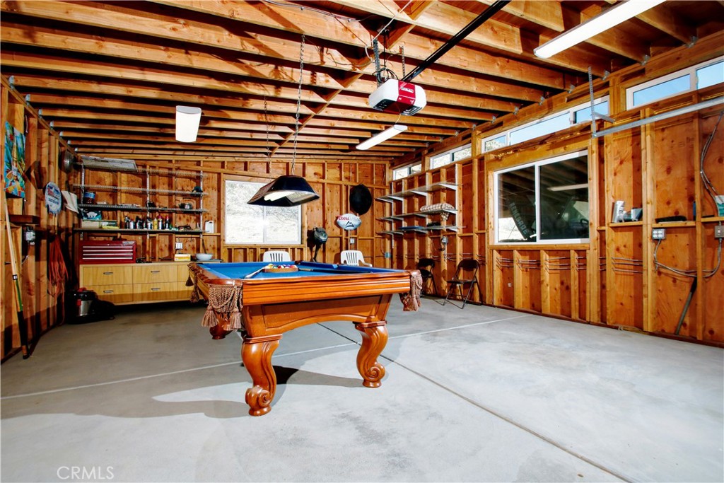 4650 Sizer Canyon Road Johnson Valley, CA 92285 - Photo 22 of 36 a backyard of a house with barbeque oven table and chairs