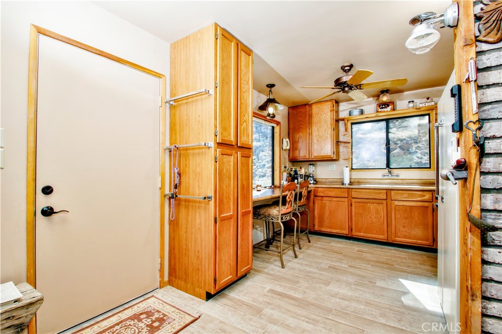 4650 Sizer Canyon Road Johnson Valley, CA 92285 - Photo 5 of 36 a view of a walk in closet and wooden floor