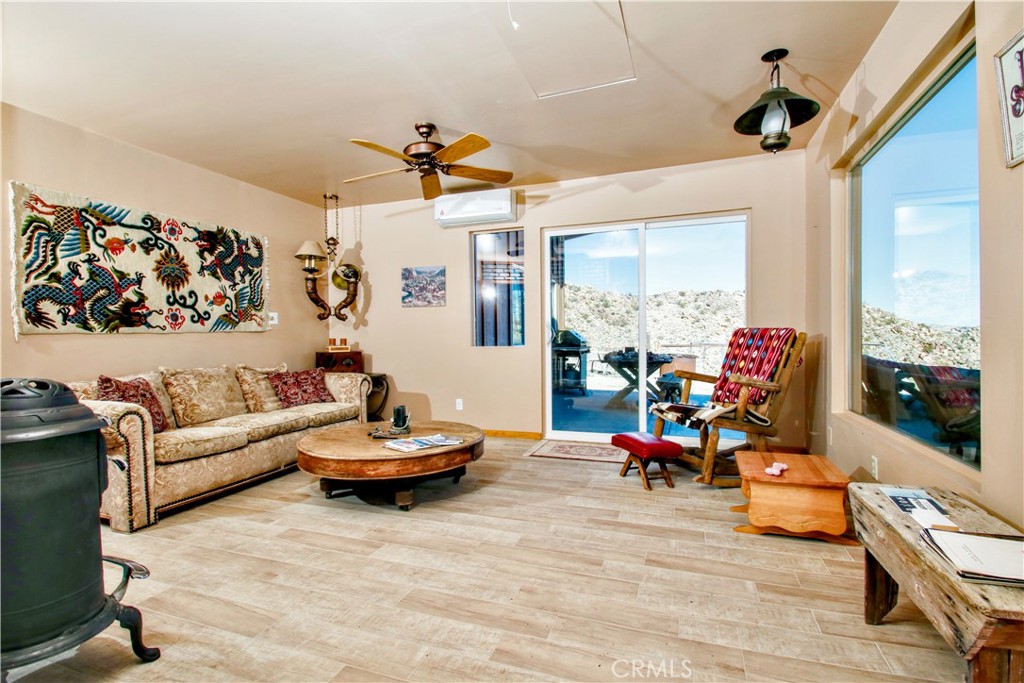 4650 Sizer Canyon Road Johnson Valley, CA 92285 - Photo 10 of 36 a living room with furniture and a large window