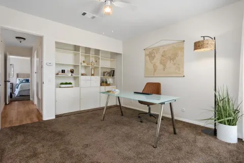 a workspace with furniture and window