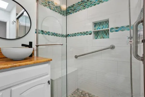 a bathroom with a sink and a mirror
