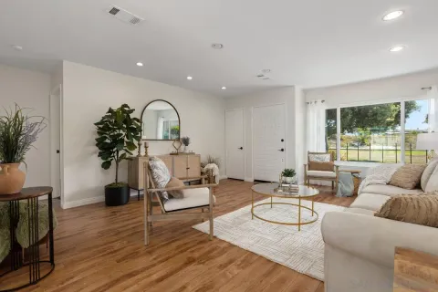 a living room with furniture and a large window