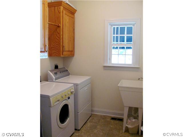 1384 Palmore Road Powhatan, VA 23139 - Photo 18 of 24 Laundry - Laundry Room has cabinet storage, a util