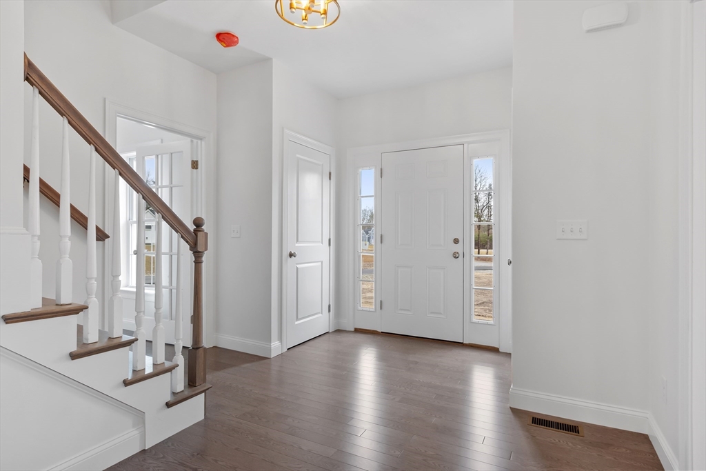 20 Rawson Farm Road Mendon, MA 01756 - Photo 12 of 35 a view of a livingroom with wooden floor and stairs