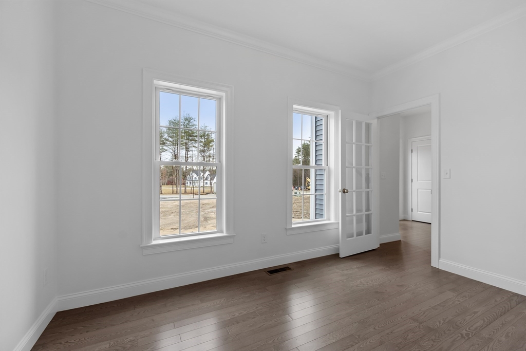 20 Rawson Farm Road Mendon, MA 01756 - Photo 13 of 35 an empty room with wooden floor and windows