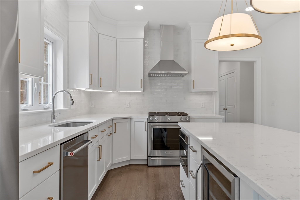 20 Rawson Farm Road Mendon, MA 01756 - Photo 2 of 35 a kitchen with stainless steel appliances a stove a sink and a microwave