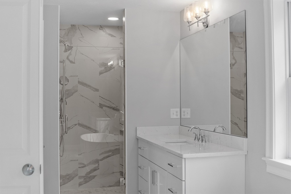 20 Rawson Farm Road Mendon, MA 01756 - Photo 24 of 35 a bathroom with a shower sink vanity and mirror