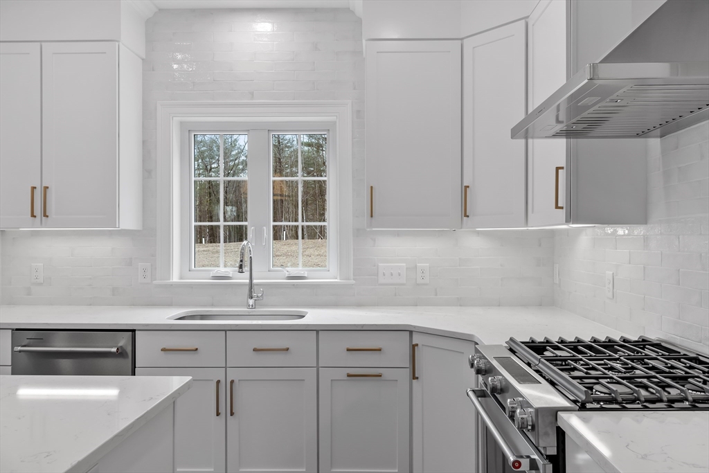 20 Rawson Farm Road Mendon, MA 01756 - Photo 4 of 35 a kitchen with granite countertop a sink a stove and cabinets