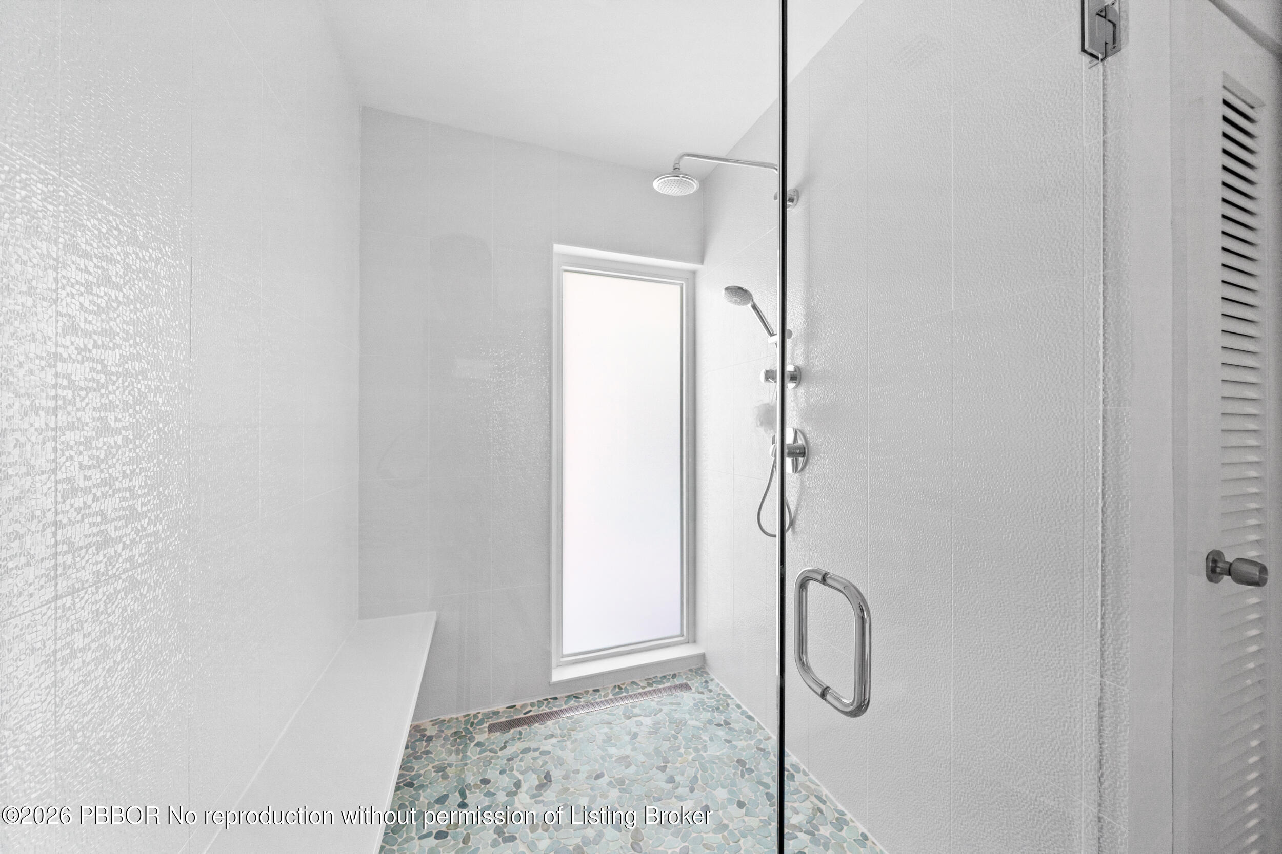 2259 Ibis Isle Road East, Unit E Palm Beach, FL 33480 - Photo 17 of 28 a bathroom with a glass shower door