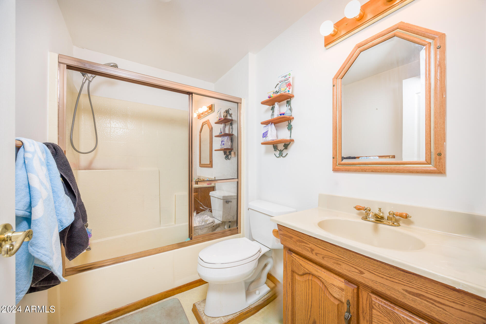2980 West Williams Road Benson, AZ 85602 - Photo 13 of 32 a bathroom with a granite countertop sink toilet and shower