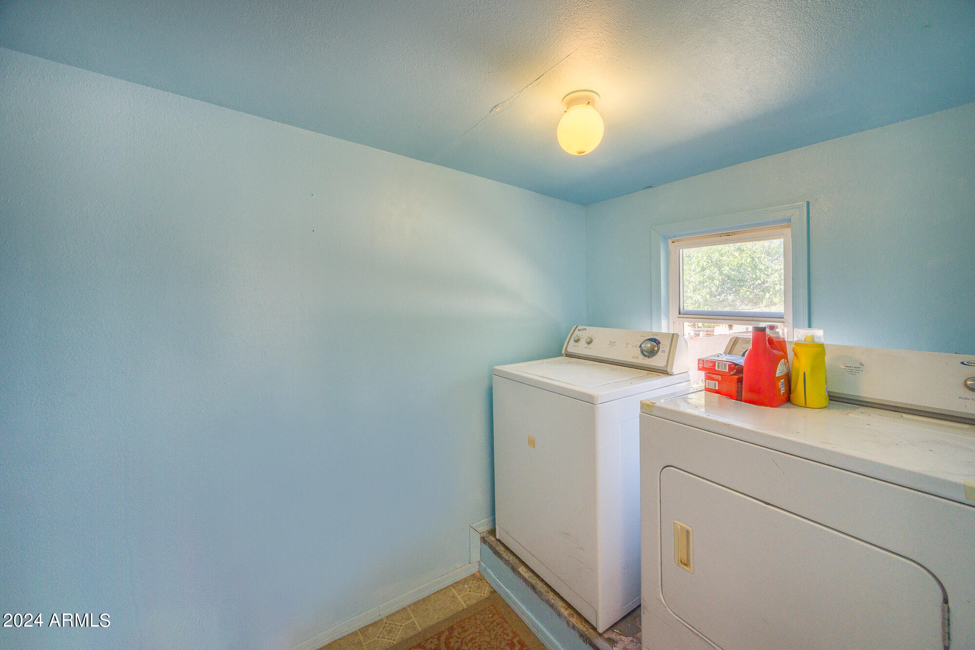 2980 West Williams Road Benson, AZ 85602 - Photo 18 of 32 a utility room with dryer and washer