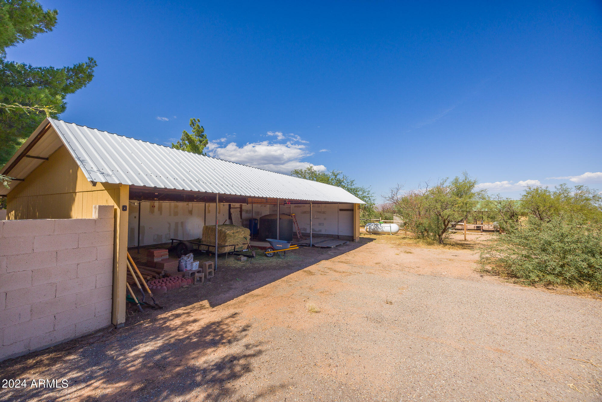 2980 West Williams Road Benson, AZ 85602 - Photo 21 of 32 a view of a house with a patio