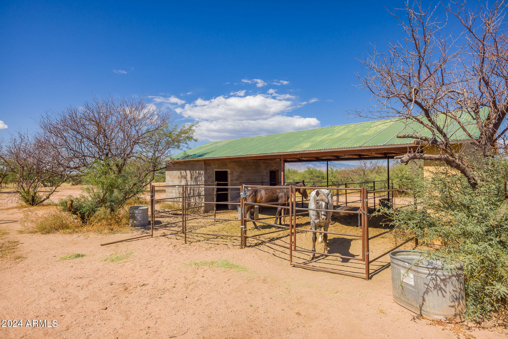 2980 West Williams Road Benson, AZ 85602 - Photo 22 of 32 a view of a patio with a yard