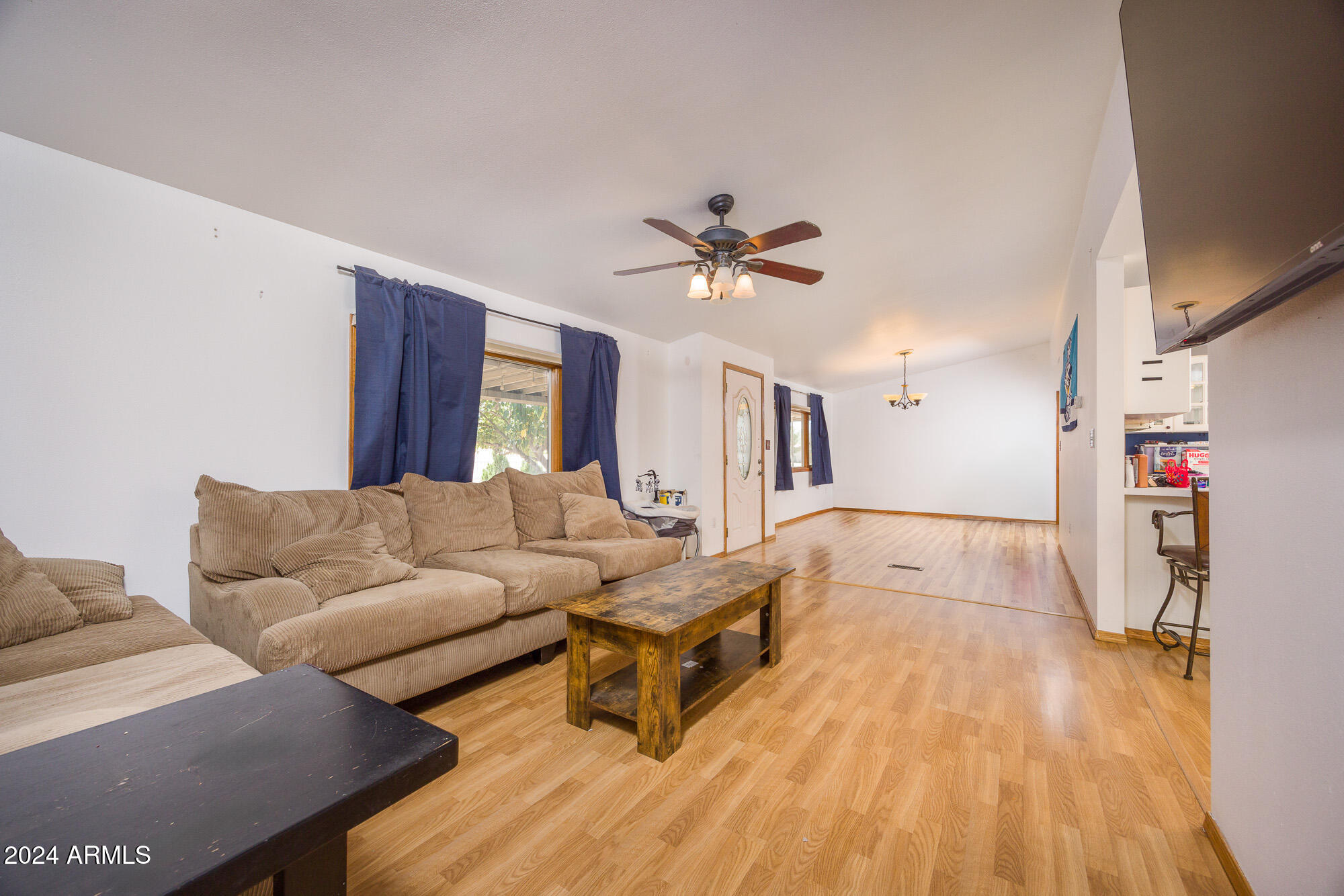 2980 West Williams Road Benson, AZ 85602 - Photo 4 of 32 a living room with furniture and a wooden floor