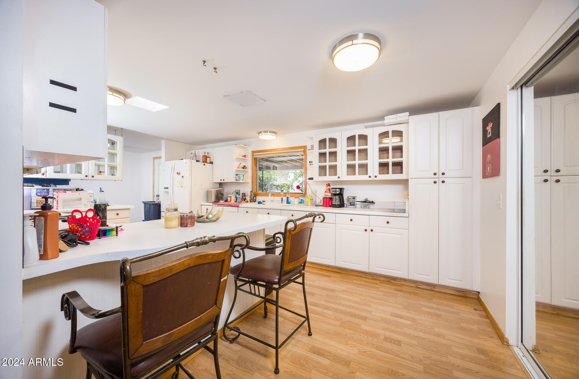 2980 West Williams Road Benson, AZ 85602 - Photo 6 of 32 a living room with stainless steel appliances kitchen island granite countertop furniture and a kitchen view