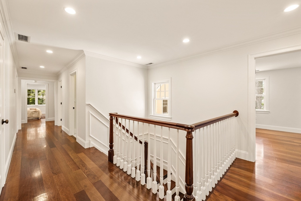245 East Street Lexington, MA 02420 - Photo 17 of 42 a view of a hallway with wooden floor and stairs