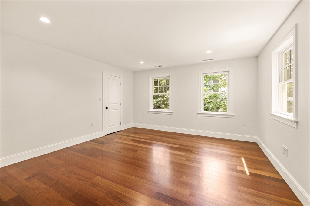 245 East Street Lexington, MA 02420 - Photo 20 of 42 an empty room with wooden floor and windows