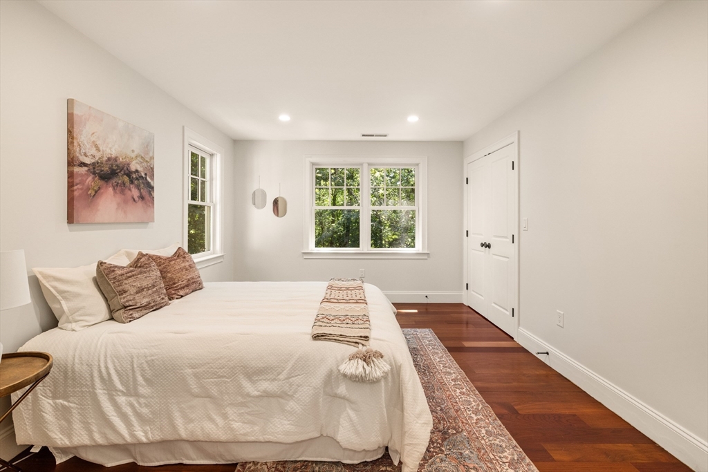 245 East Street Lexington, MA 02420 - Photo 22 of 42 a bedroom with a large bed and a window