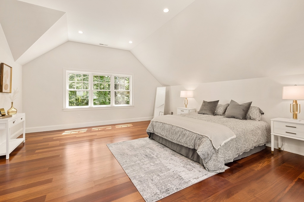 245 East Street Lexington, MA 02420 - Photo 25 of 42 a spacious bedroom with a bed and a large window