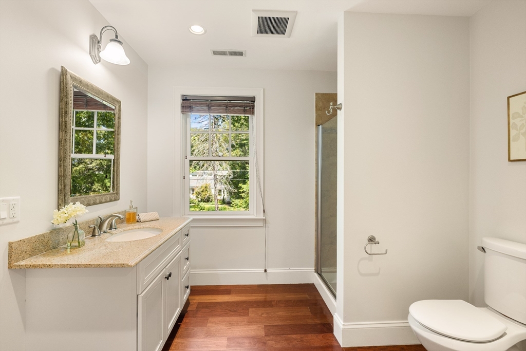 245 East Street Lexington, MA 02420 - Photo 26 of 42 a bathroom with a sink vanity granite and toilet