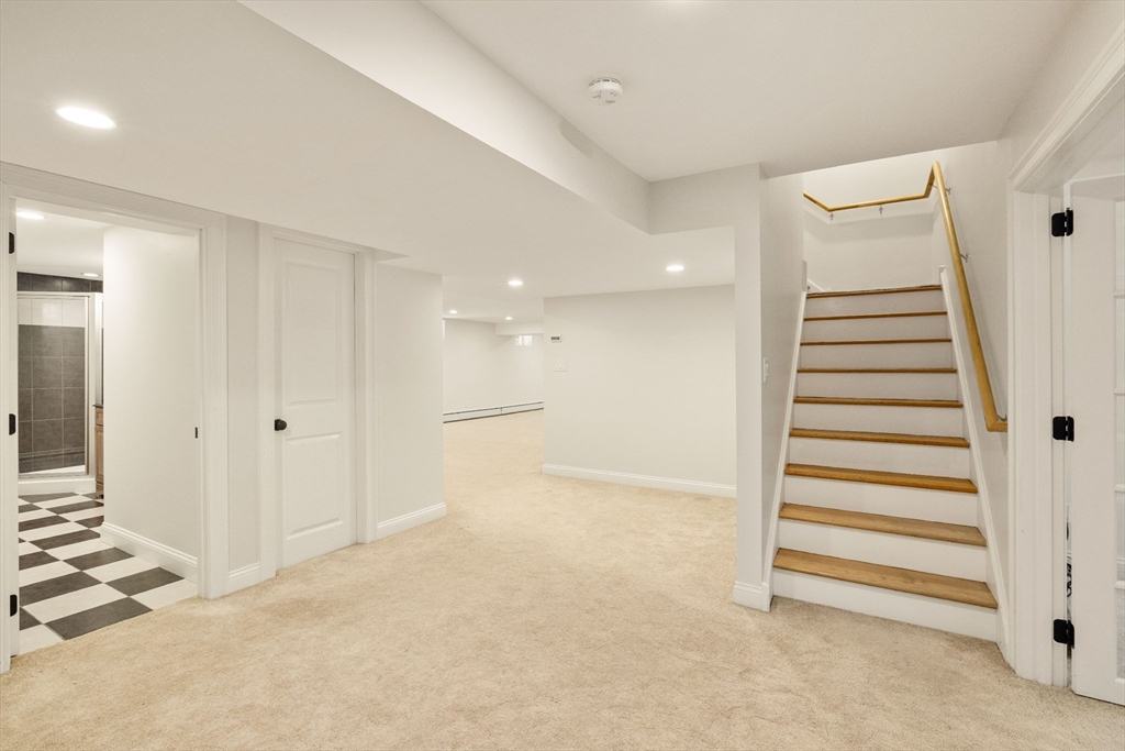 245 East Street Lexington, MA 02420 - Photo 32 of 42 a view of a room with stairs and a ceiling fan
