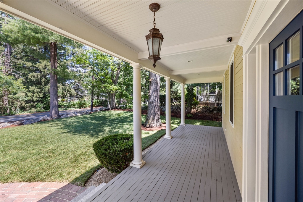245 East Street Lexington, MA 02420 - Photo 38 of 42 a very nice looking house with a big yard and potted plants