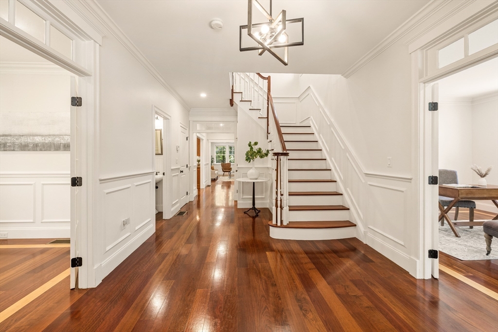 245 East Street Lexington, MA 02420 - Photo 4 of 42 a view of a hallway with wooden floor and staircase