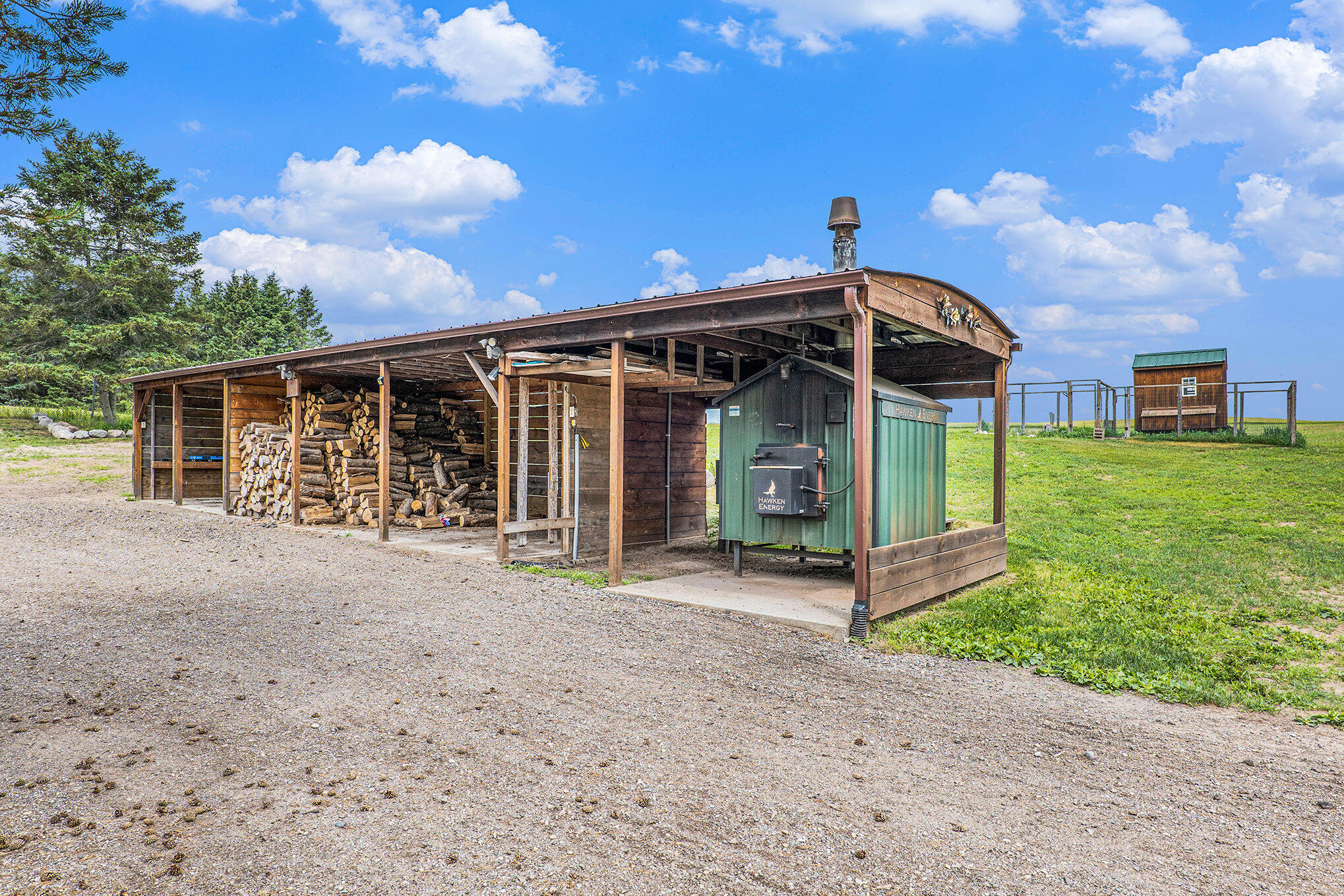 10770 21 Mile Road Evart, MI 49631 - Photo 12 of 35 Wood Storage Wood Burner