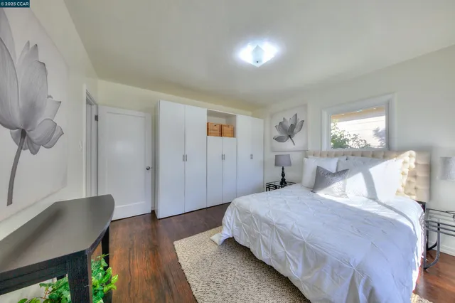 a bedroom with a bed and a chair