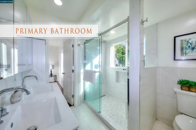 a spacious bathroom with a granite countertop sink