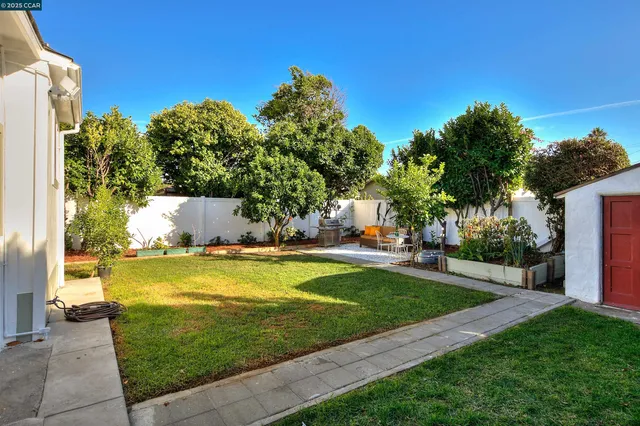 a view of a house with swimming pool and a yard