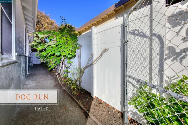 a view of a street with potted plants