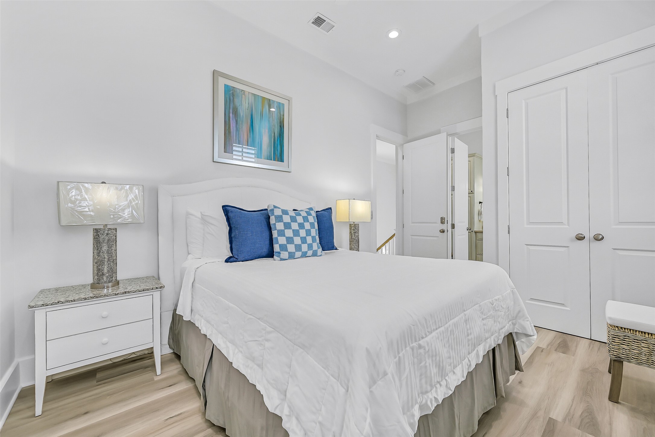 817 Positano Road Galveston, TX 77550 - Photo 27 of 50 Designed with both comfort and privacy in mind, this spacious bedroom features updated furnishings and easy access to its own ensuite bath. Soft coastal tones and a refreshed interior create a space guests will look forward to returning to after a day of island adventures.