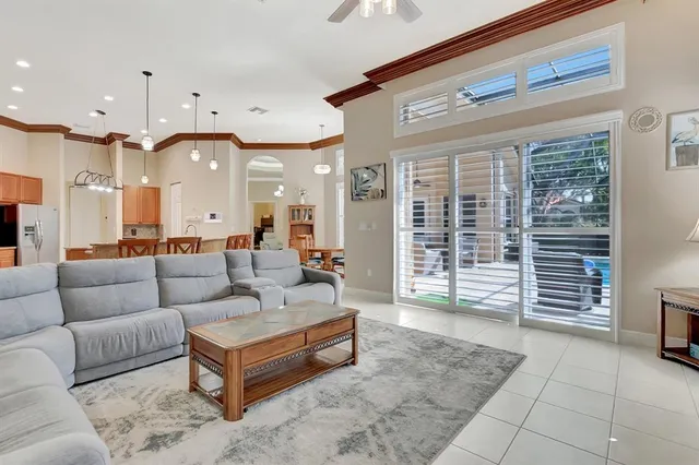 a bathroom with a double vanity sink a toilet a mirror and shower