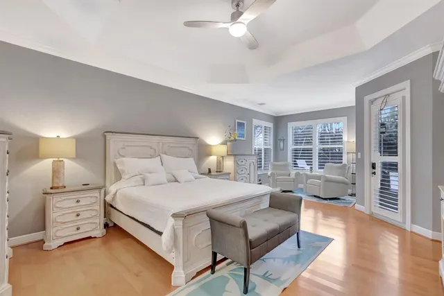 a view of a backyard with table and chairs under an umbrella