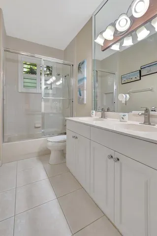 an aerial view of a house with a yard and garden