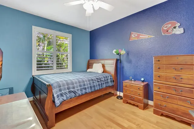 a view of an entrance to house with yard and green space