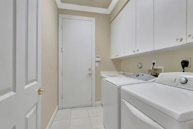 an aerial view of a house with garden space and street view