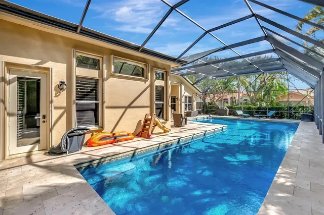 a view of swimming pool with outdoor seating