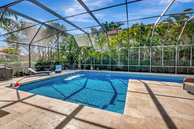 a very nice looking living room with kitchen view and a wooden floor