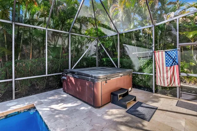 a kitchen with stainless steel appliances granite countertop a refrigerator a stove and a wooden floors